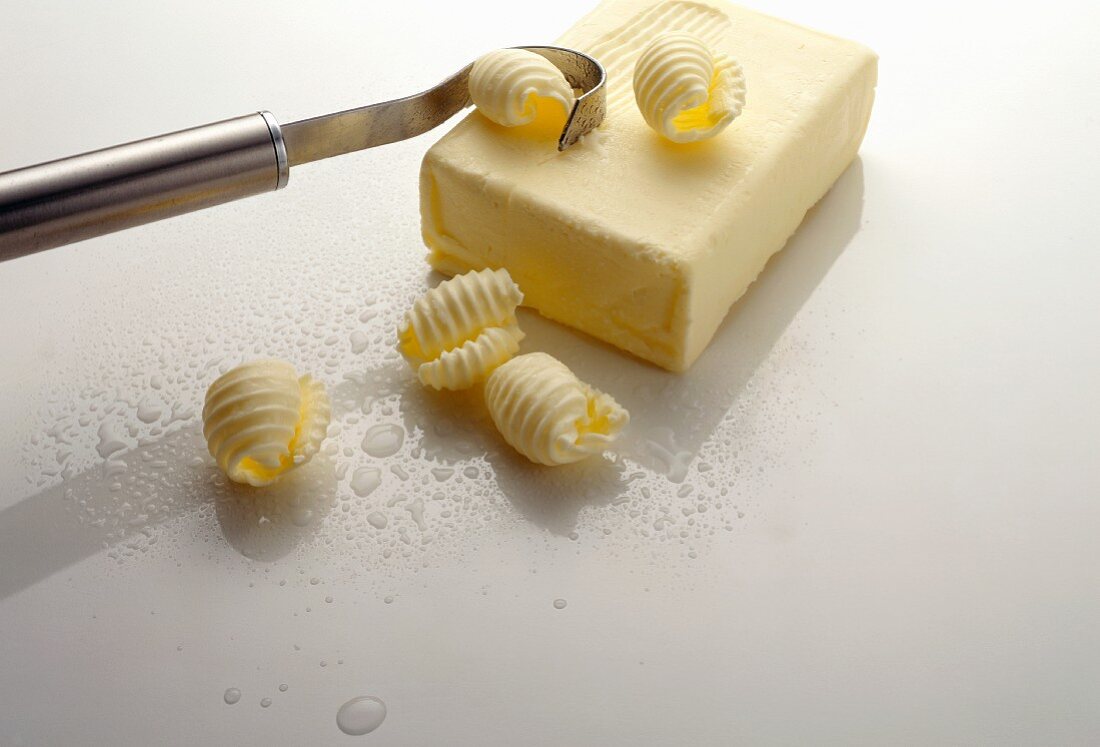 Butter curler making butter curls from block of butter