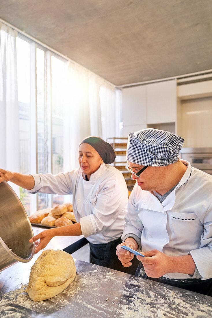 Chef and student with Down Syndrome baking bread