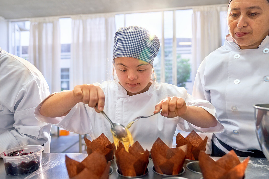 Young woman with Down Syndrome in baking class