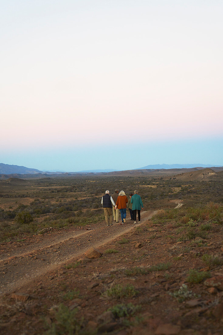 Group walking along dirt road on remote wildlife reserve