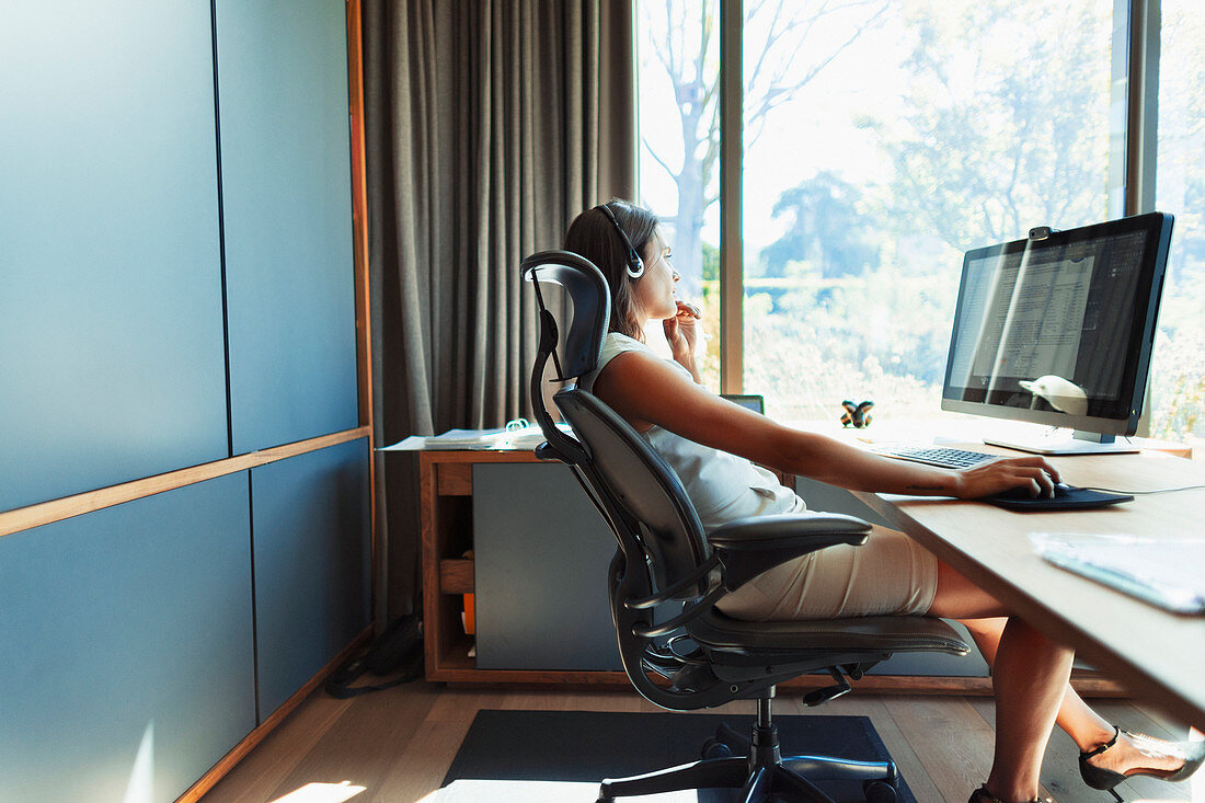 Businesswoman working at desk in office