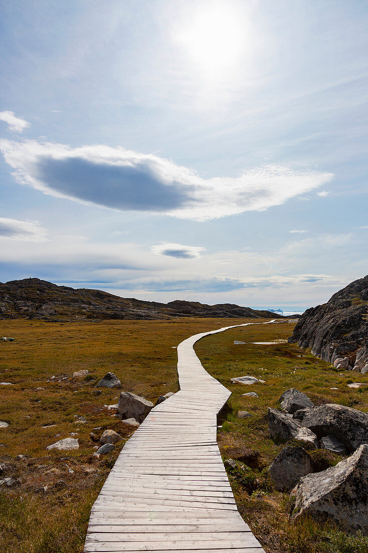 Sunny footpath among remote landscape Greenland