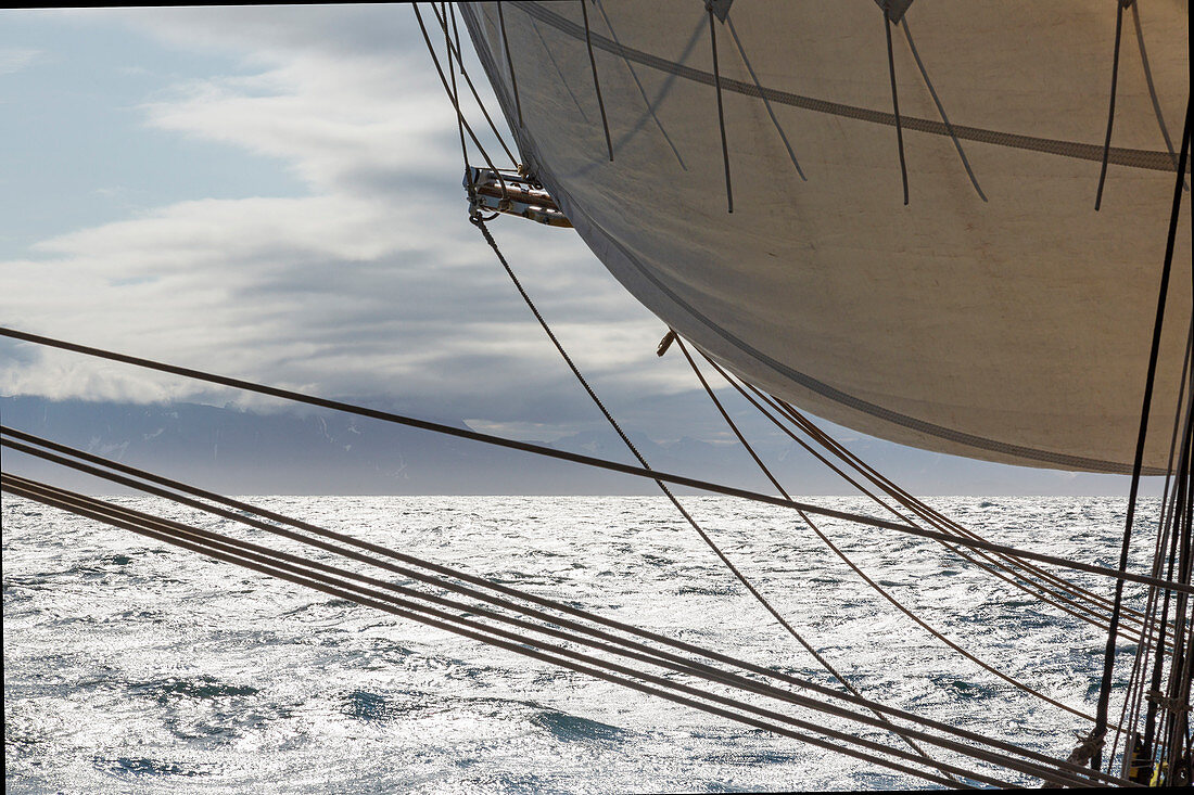 Sailboat sail and rigging over Atlantic Ocean
