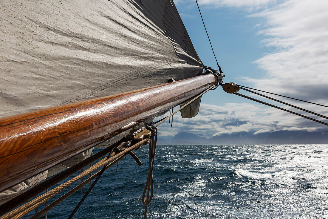 Wooden sailboat mast over Atlantic Ocean Greenland