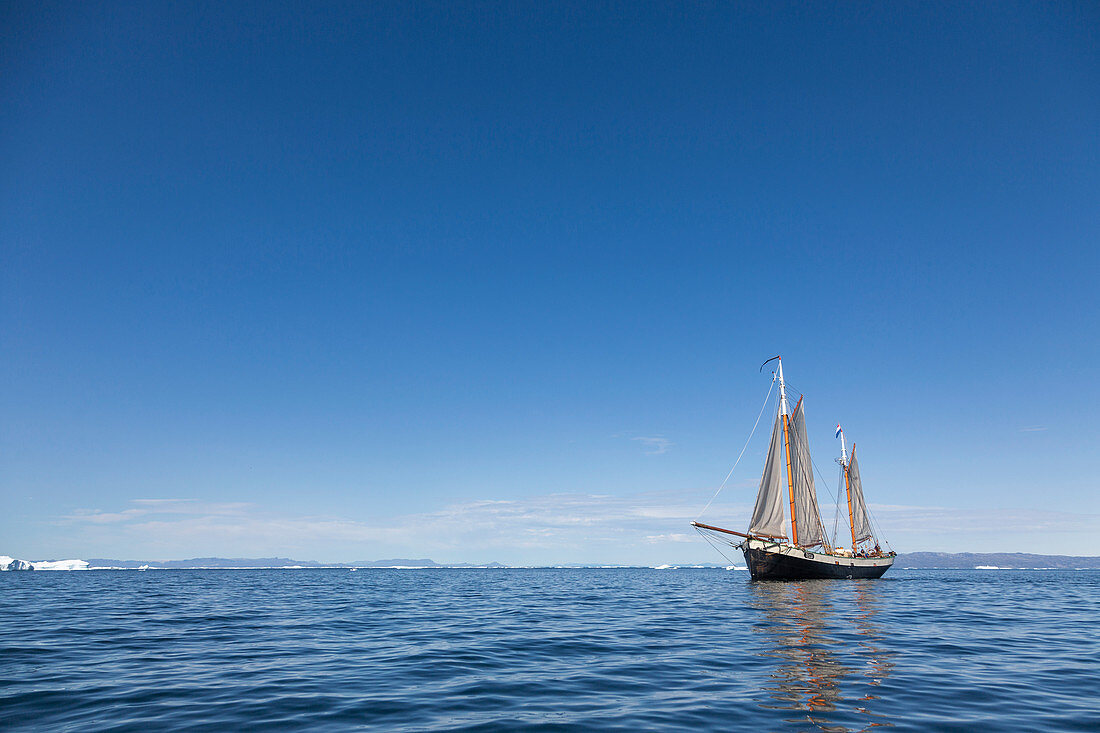 Ship sailing on blue Atlantic Ocean Greenland
