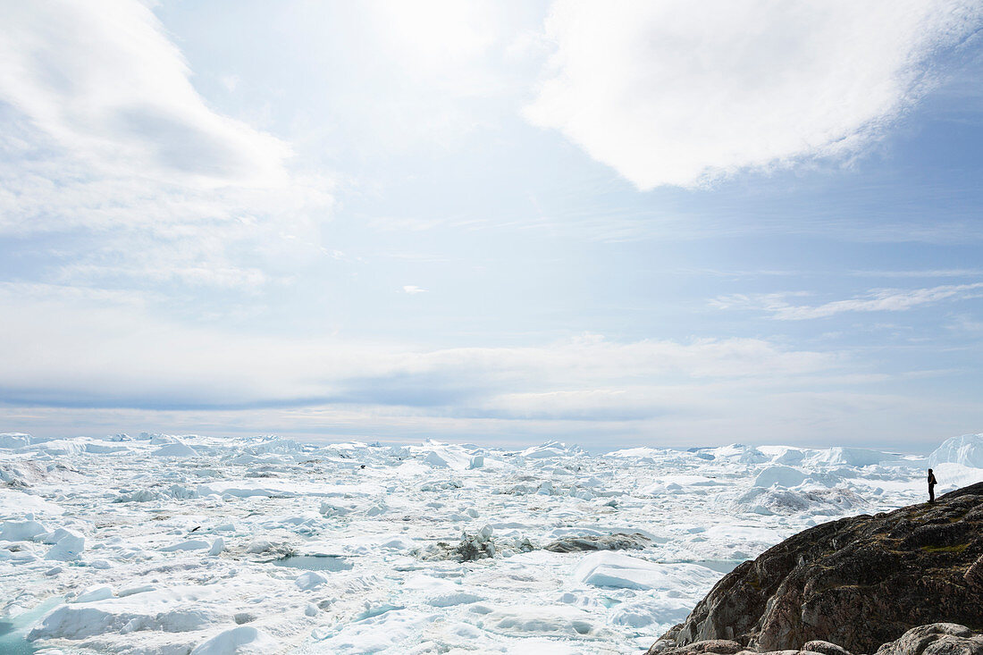 Glacial ice melting below sky Greenland