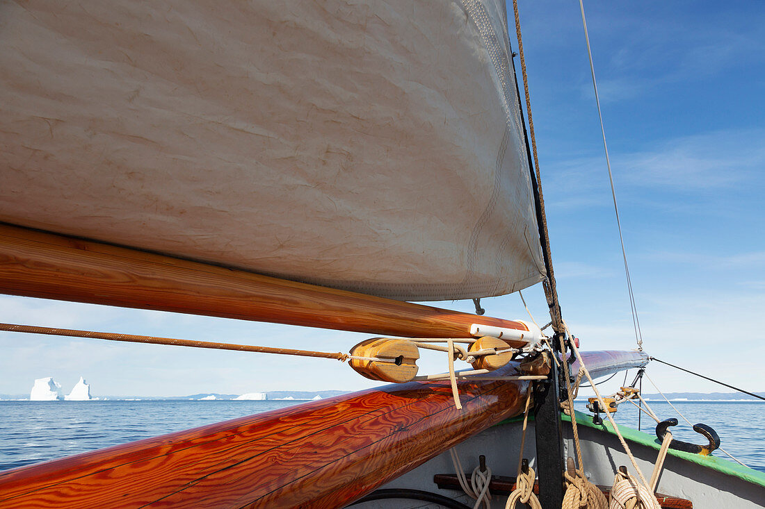 Wooden sailboat mast on arctic ocean