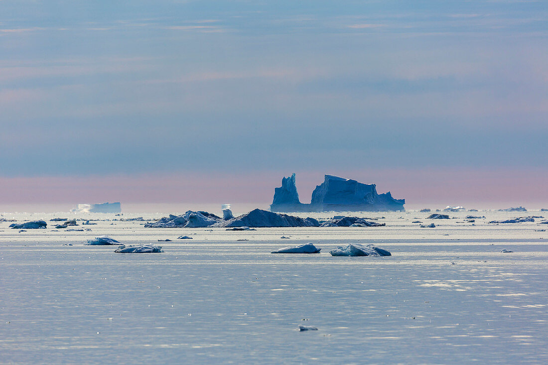 Melting icebergs over tranquil Atlantic Ocean Greenland