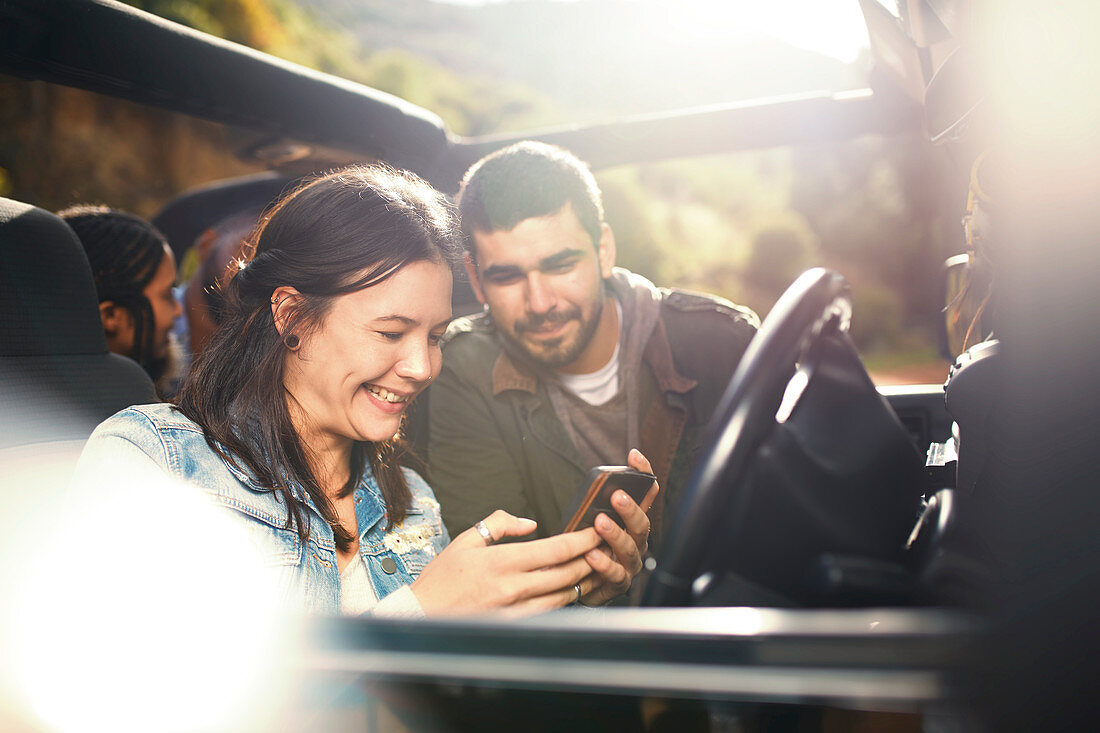 Young couple checking GPS on smart phone