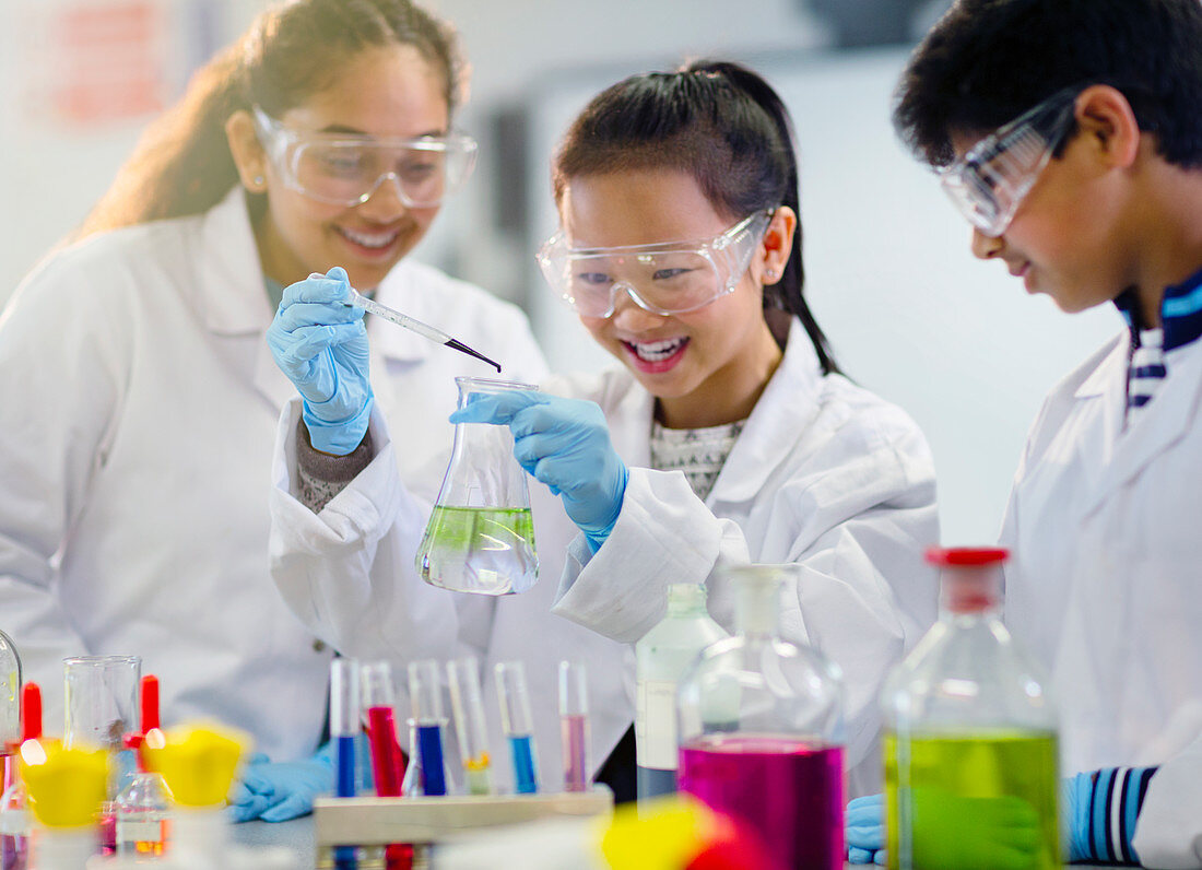 Students conducting scientific experiment in classroom