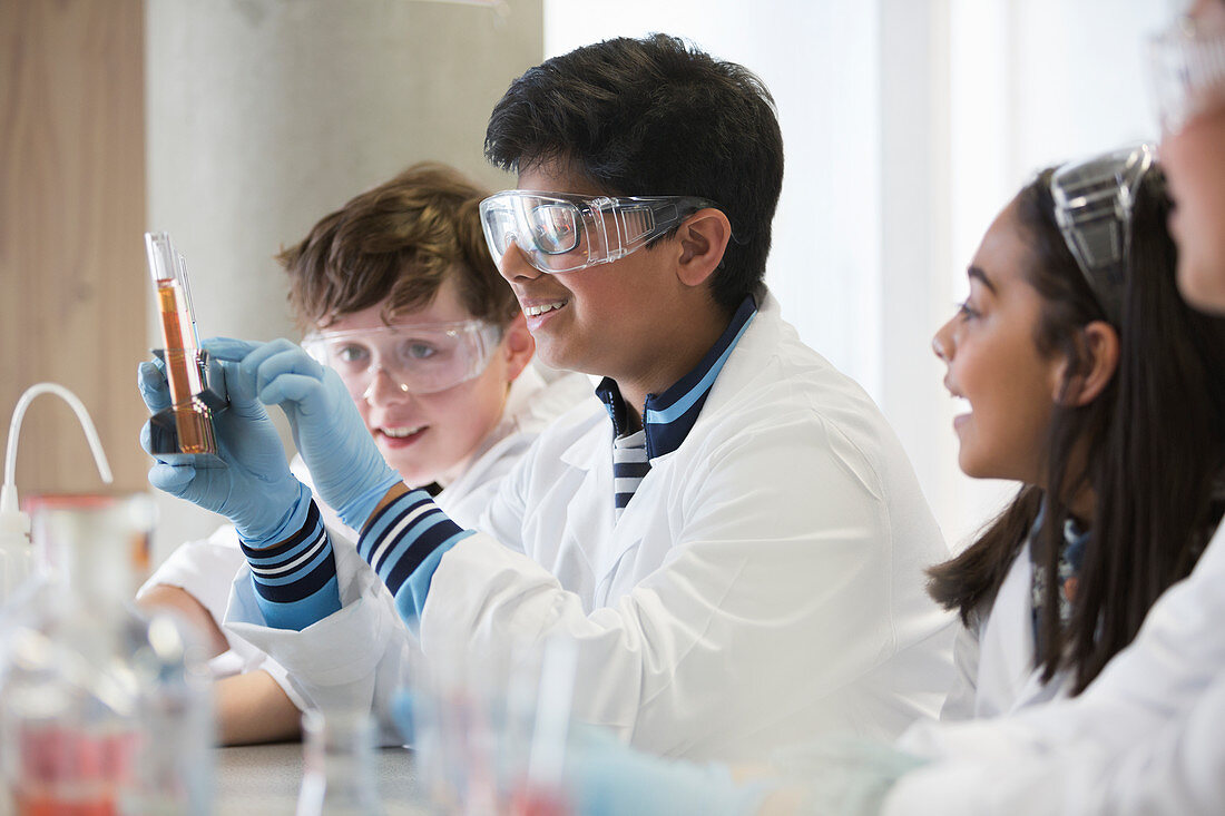 Students conducting scientific experiment in classroom