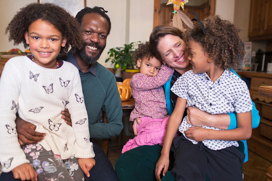 Portrait happy multiethnic family at home
