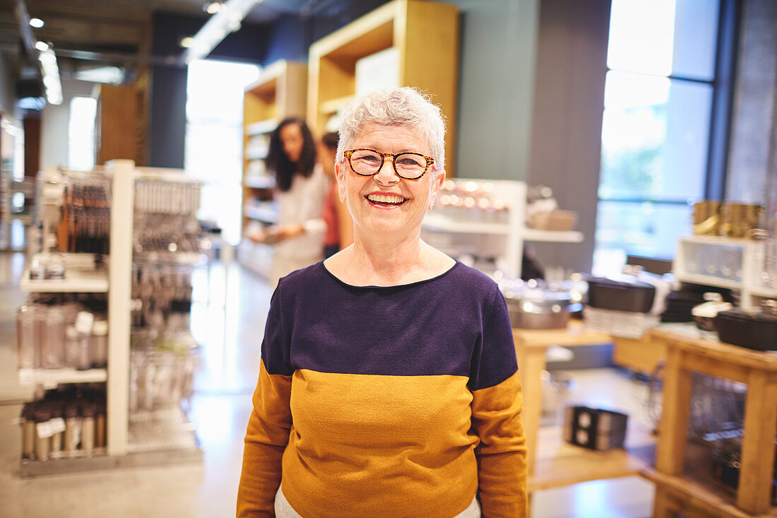 Portrait happy senior woman shopping in home goods store