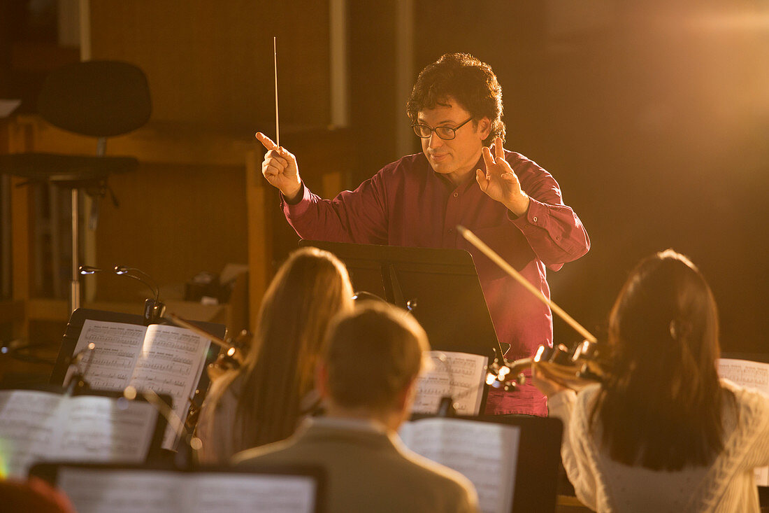 Conductor leading orchestra