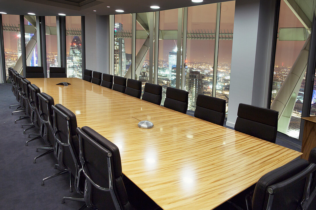 Empty conference room overlooking London at night