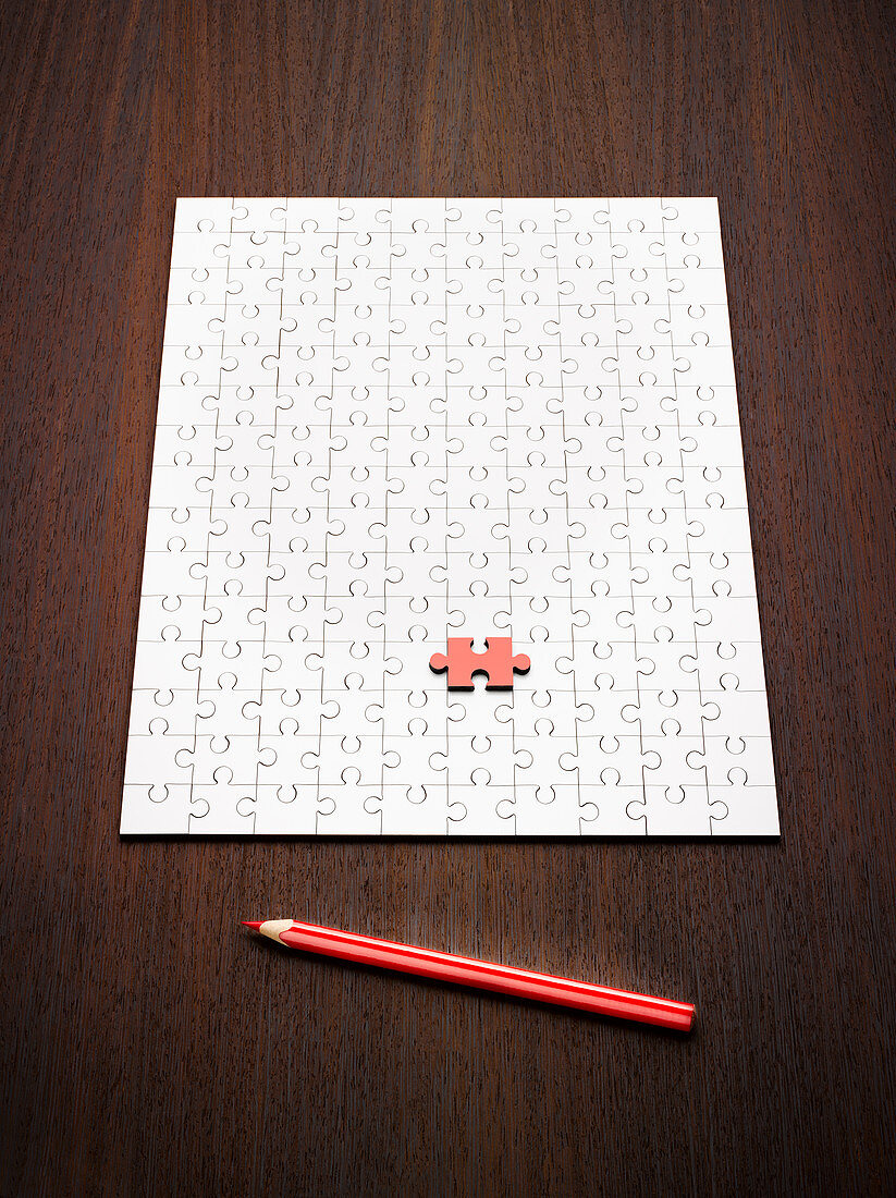 Coloring pencil by puzzle and red puzzle piece