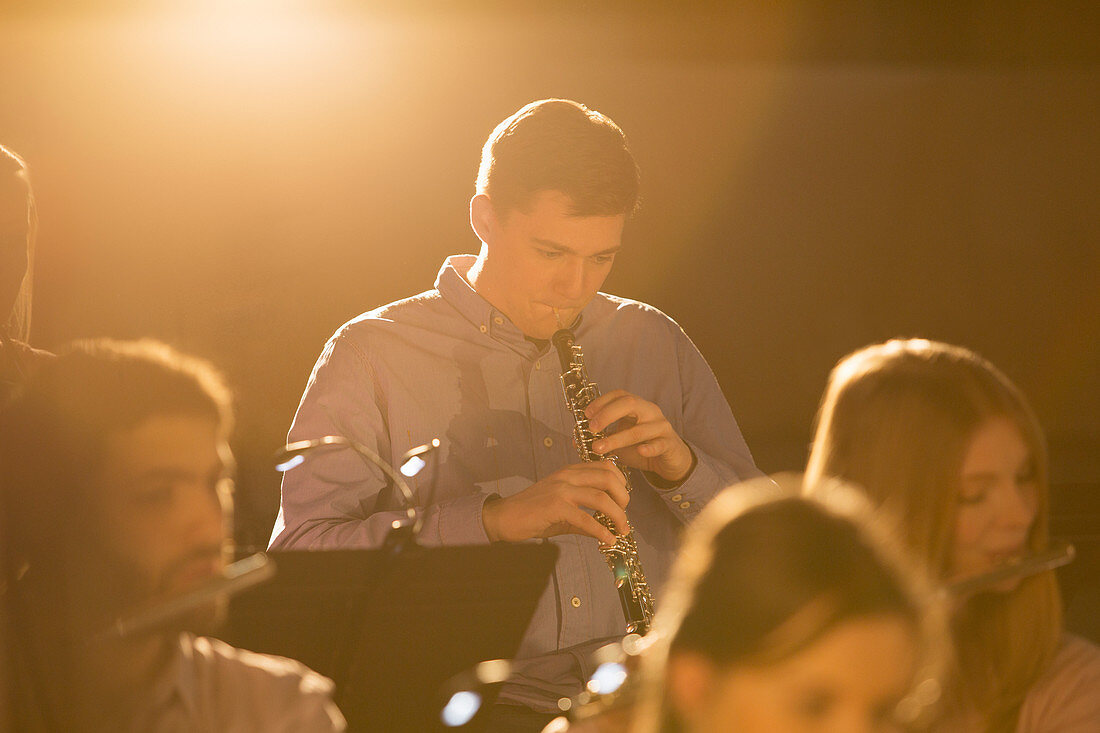 Oboist performing in orchestra