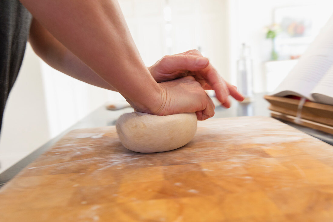 Close up woman kneading dough