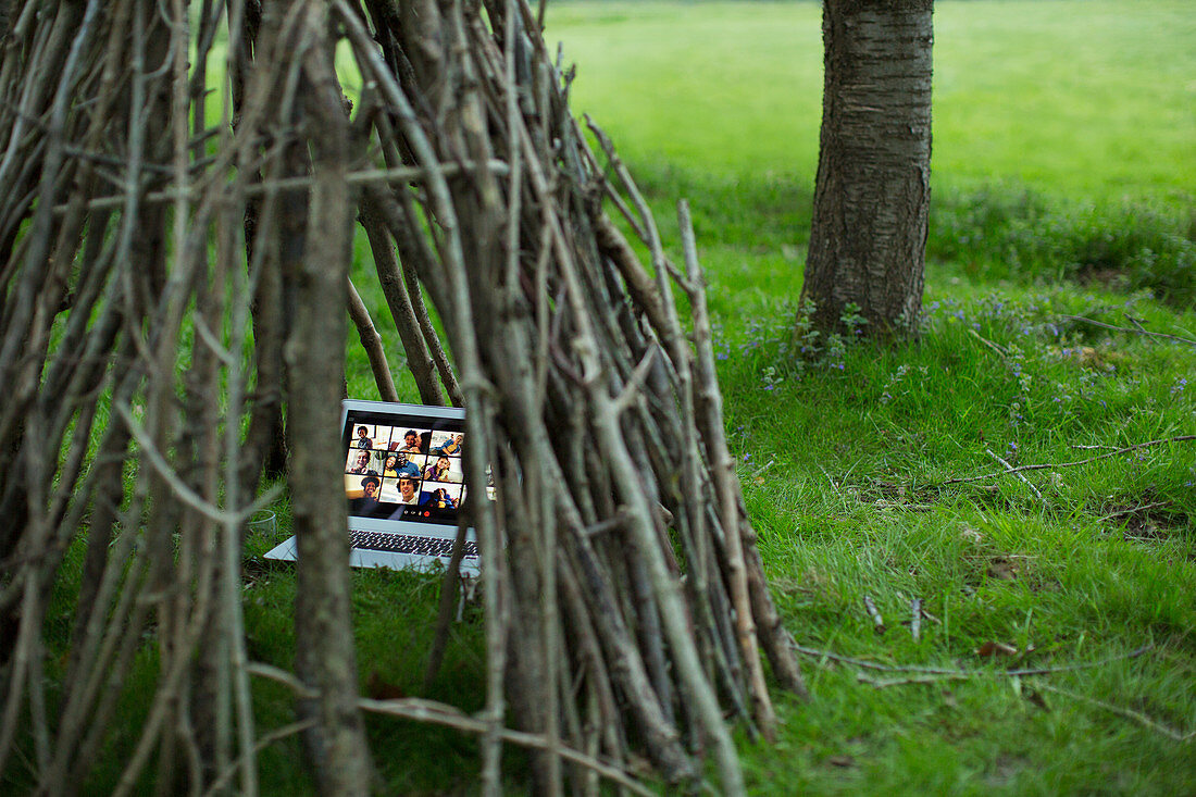 Video conference on laptop in branch teepee