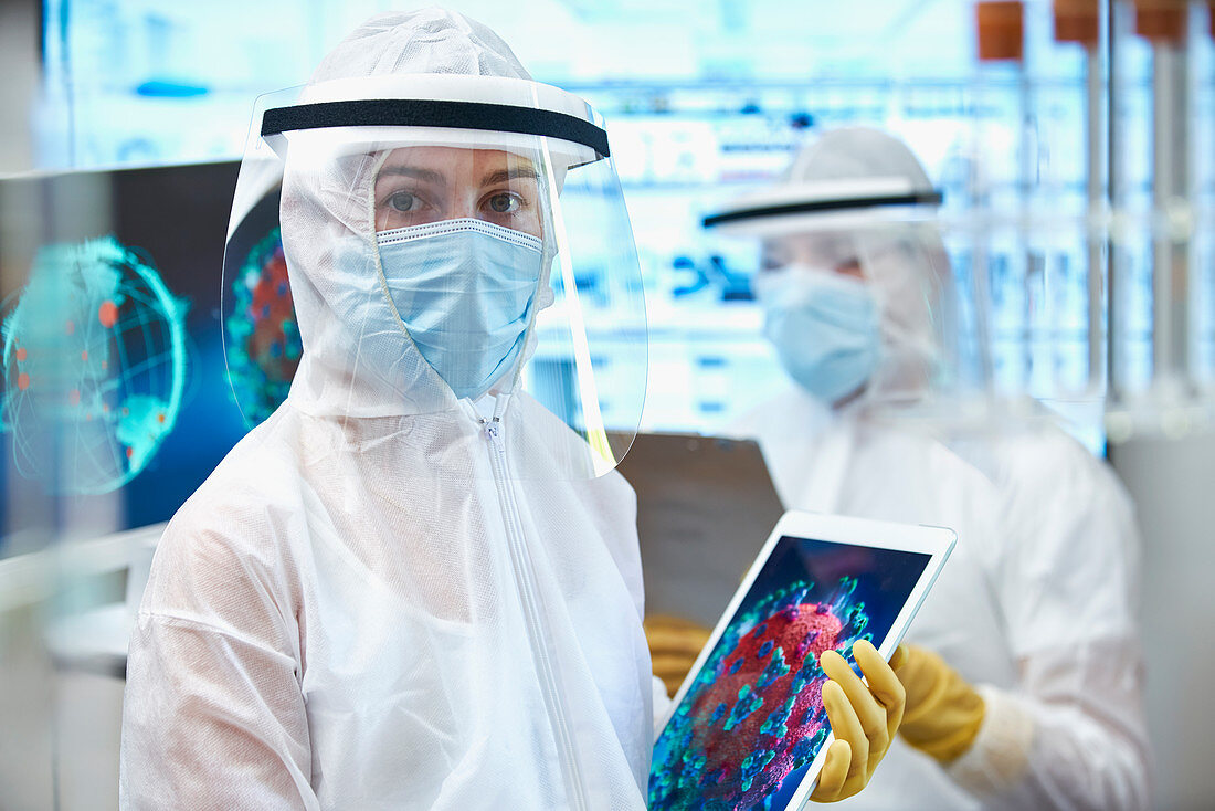 Female scientist in clean suit researching coronavirus