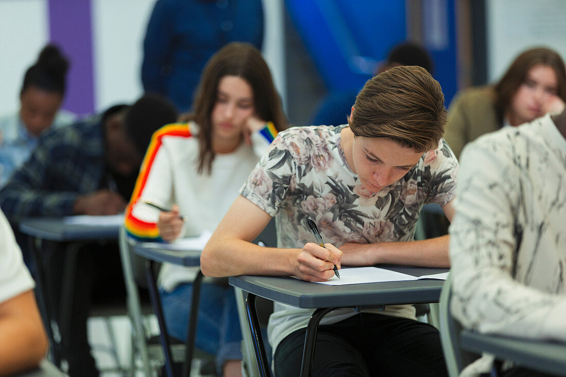Focused high school students taking exam