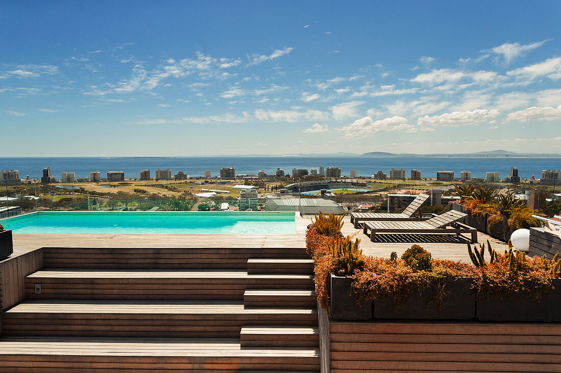 Sunny, modern rooftop swimming pool