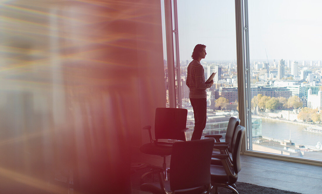 Thoughtful businessman standing