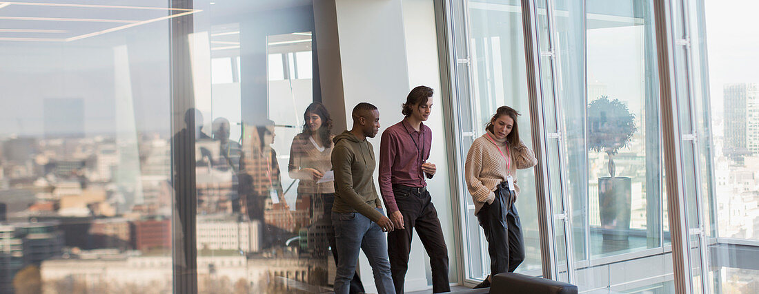 Business people walking in urban office