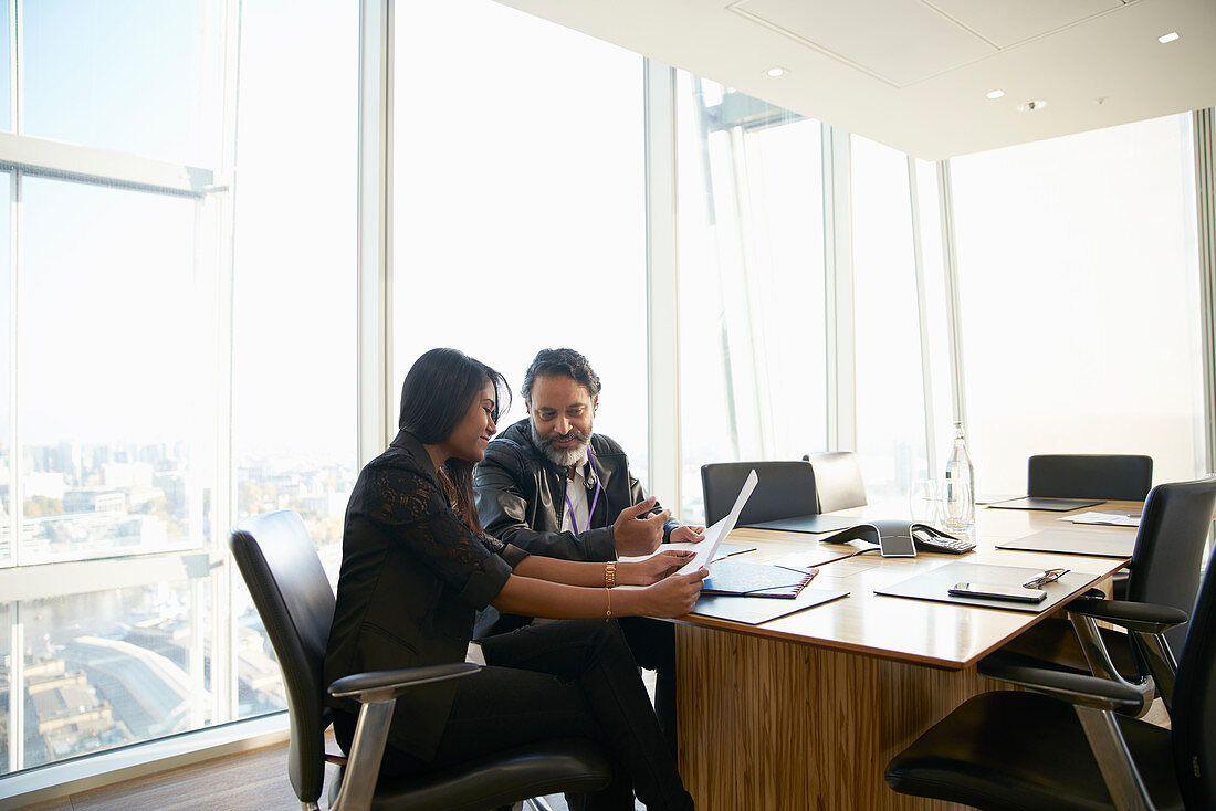 Business people discussing paperwork