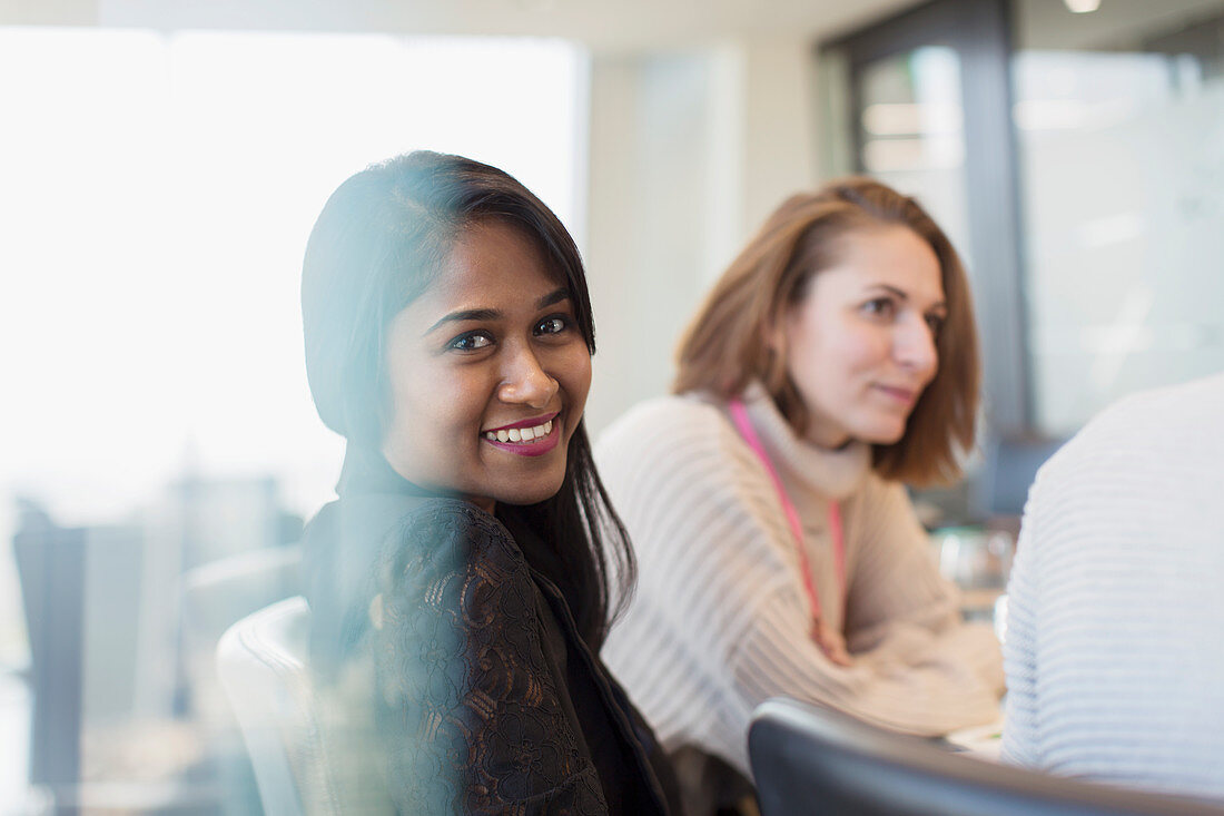 Portrait smiling businesswoman in meeting