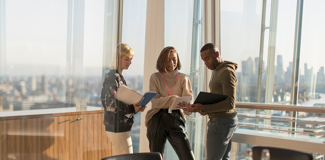 Business people discussing paperwork