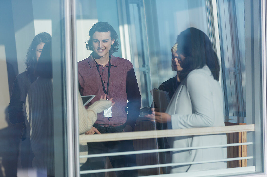 Business people talking in sunny window