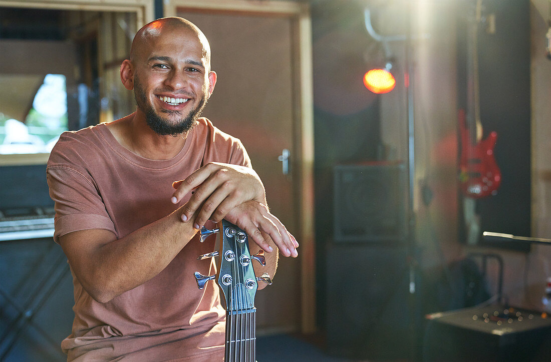 Portrait male musician with guitar