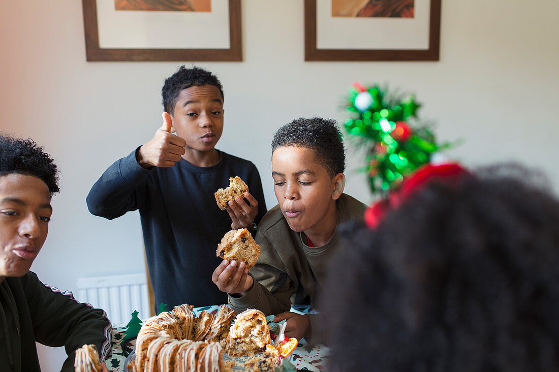 Hungry brothers eating Christmas bread