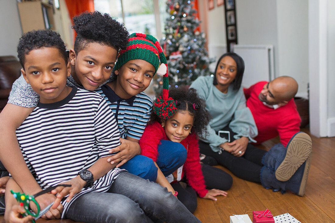 Family celebrating Christmas in living room