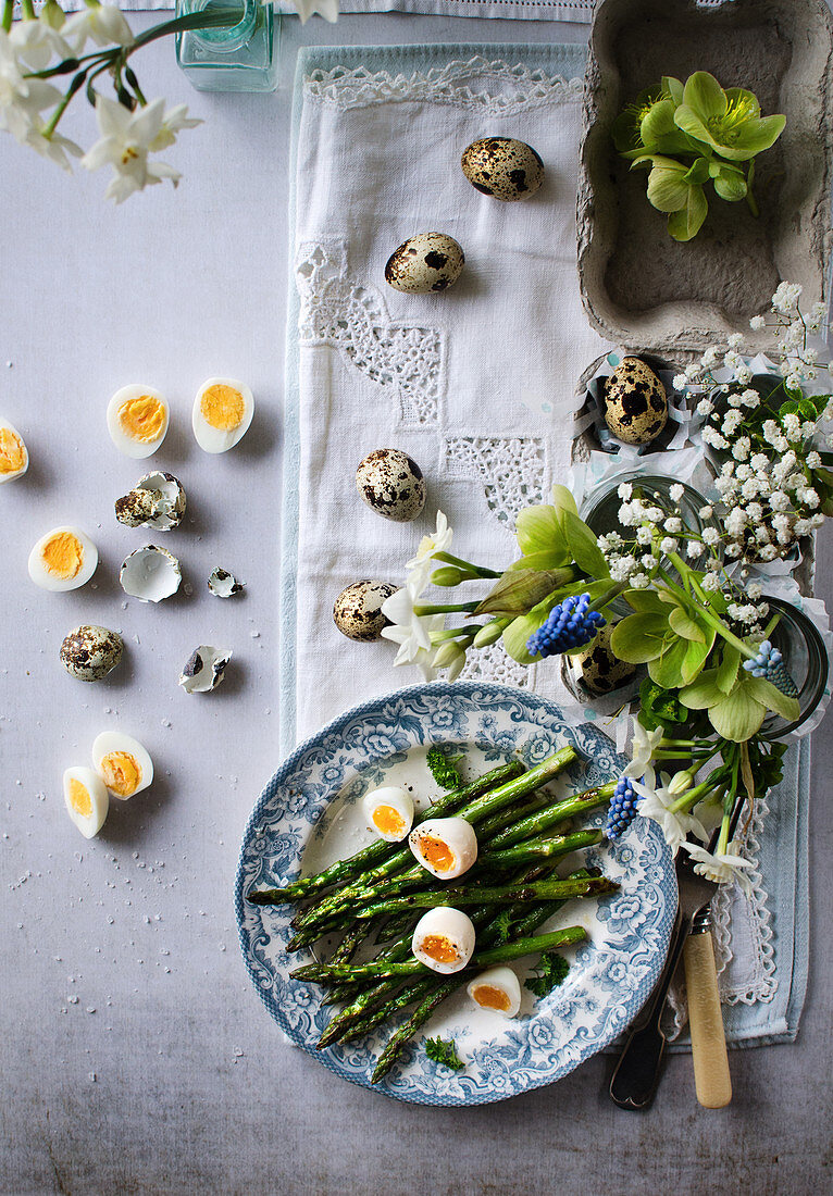 Asparagus and quail eggs on Easter table
