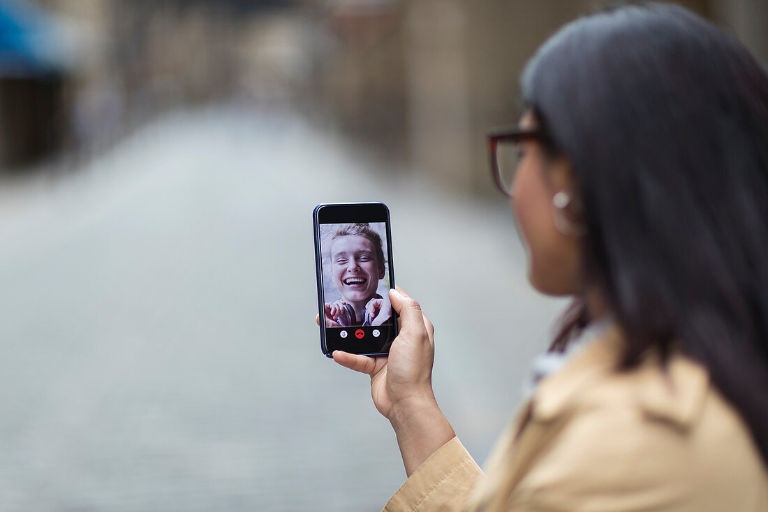 Women friends video chatting