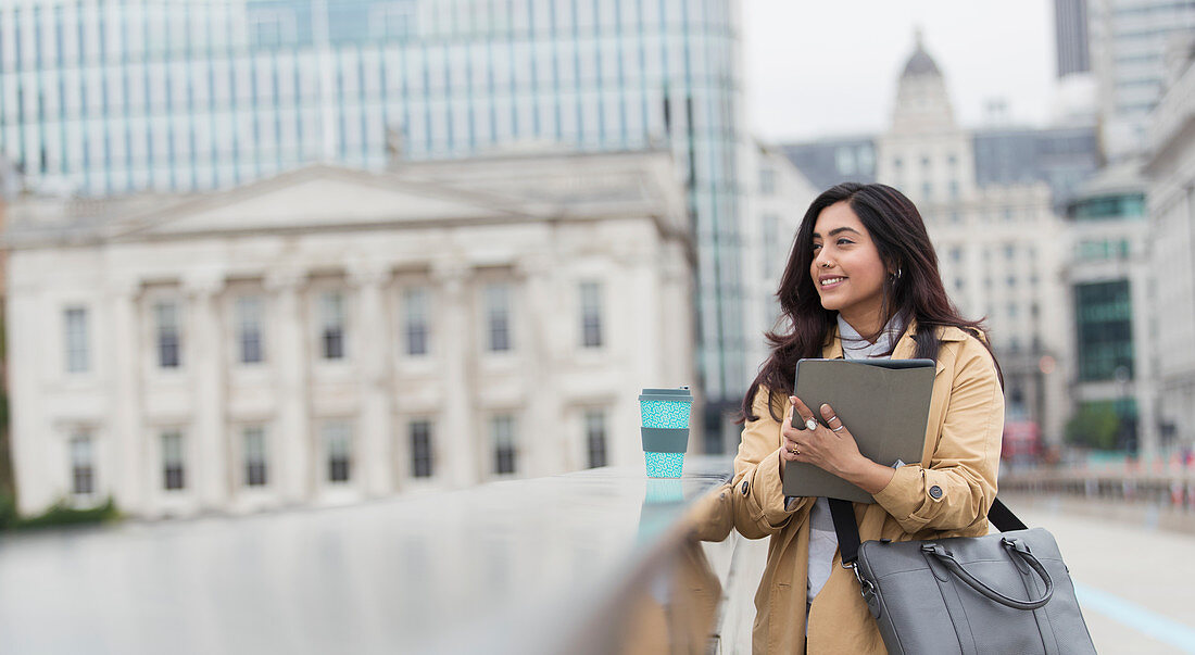 Businesswoman with digital tablet and coffee