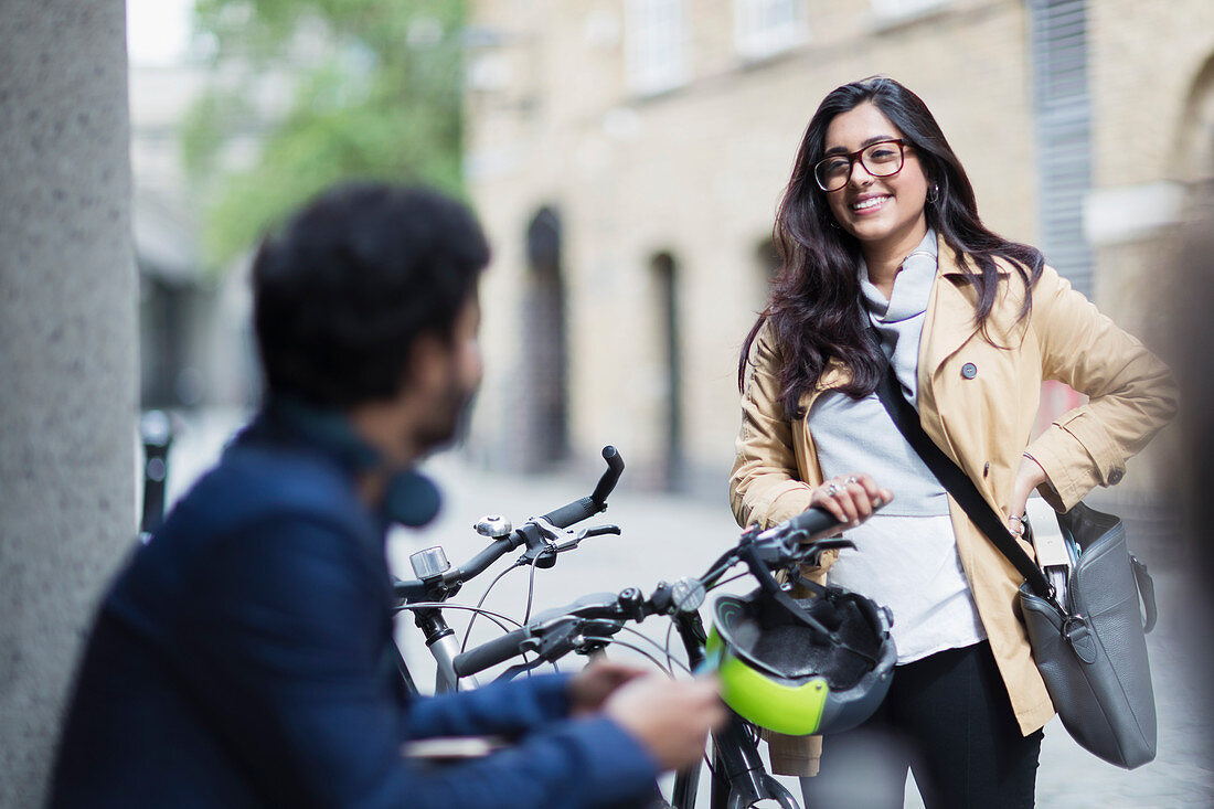 Business people with bicycles talking