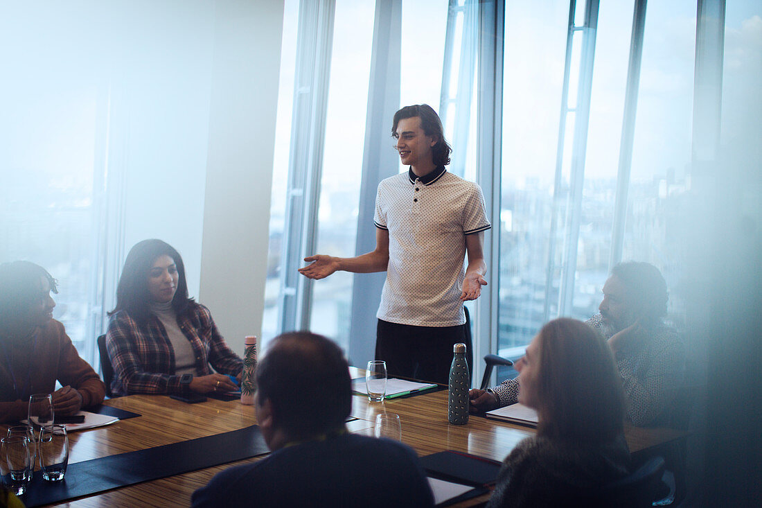 Businessman leading conference room meeting