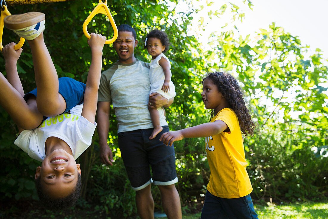 Happy family playing in summer backyard