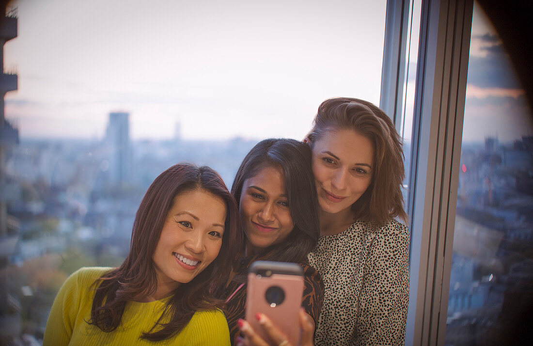 Businesswomen taking selfie with smart phone