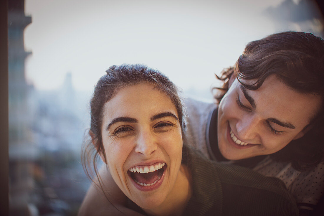 Close up portrait laughing young couple