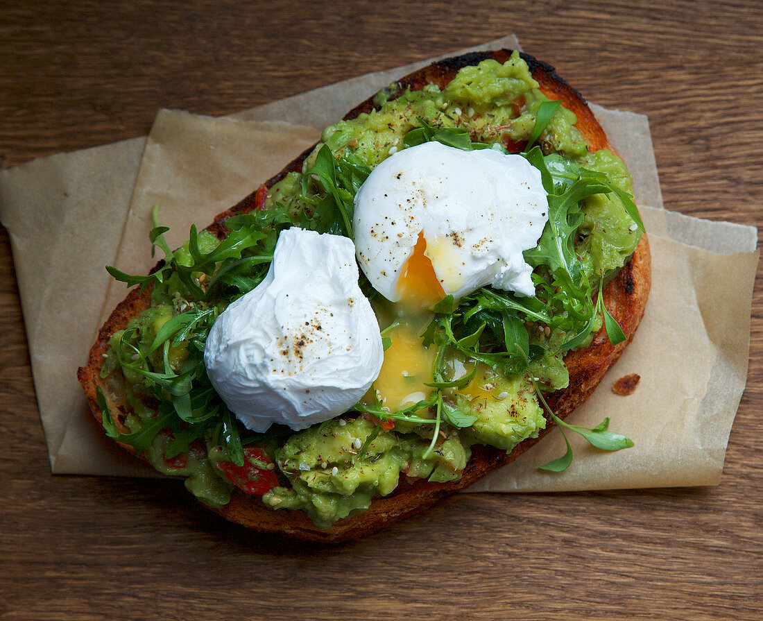 Avocado, bruschetta and poached eggs on toast