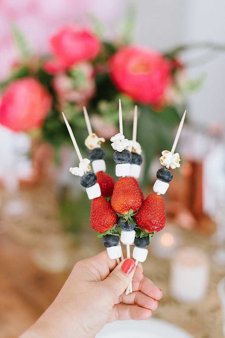 Fruit skewers with mini marshmallows and popcorn