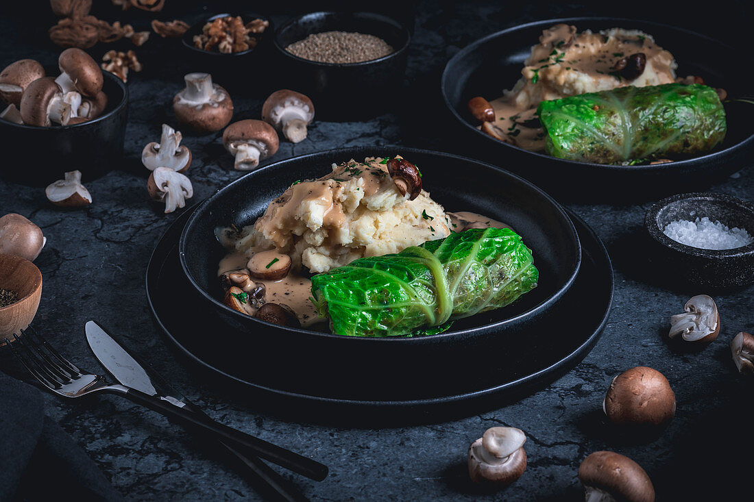 Vegetarian savoy cabbage roulade with a mushroom and quinoa filling