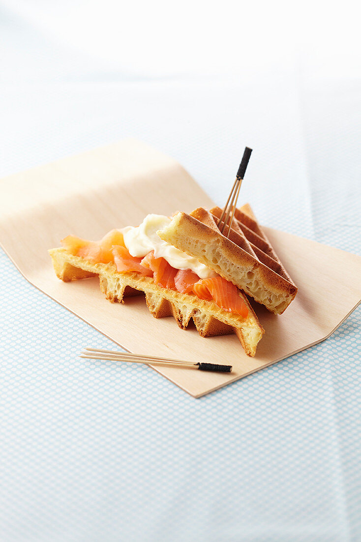 A waffle croque monsieur with smoked salmon