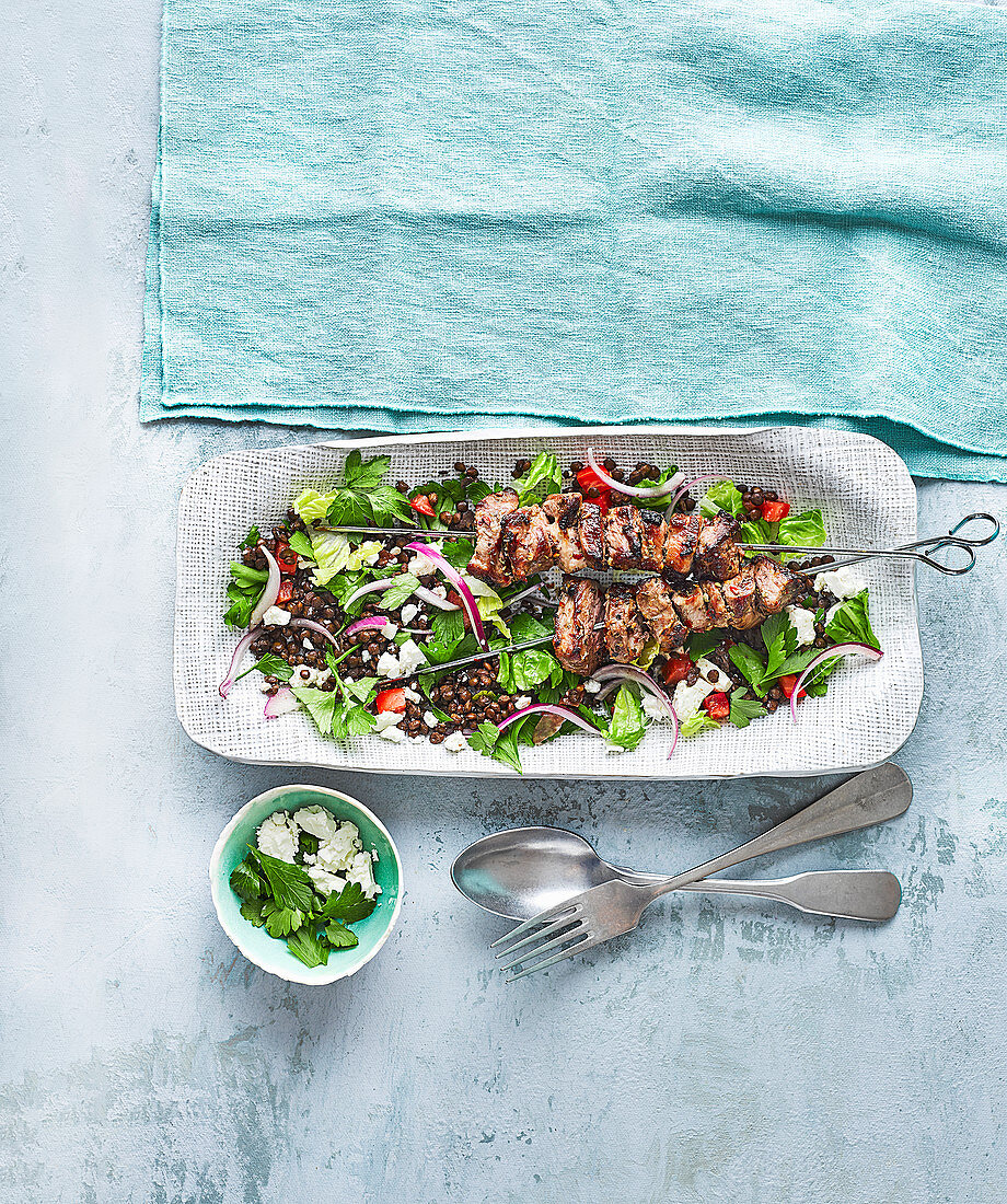 Lamb skewers with lentil salad and feta