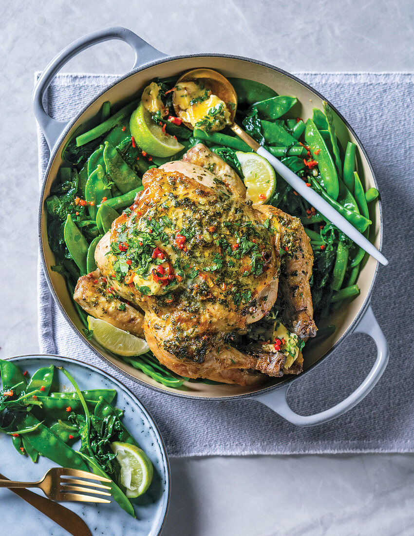 Herb-chilli butter roast chicken with green vegetable