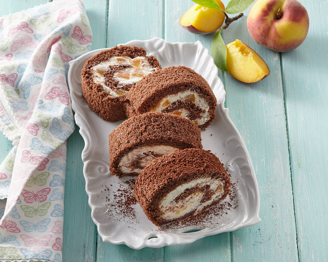 Cocoa roll with white chocolate and peaches